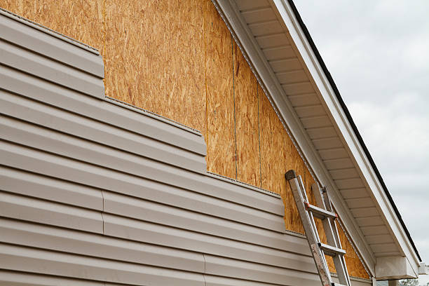 Professional Siding technician working in Herminie, PA